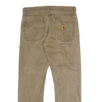 CARHARTT Mens Regular Fit Beige Denim Jeans W34 L30 Cotton Blend Button Closure