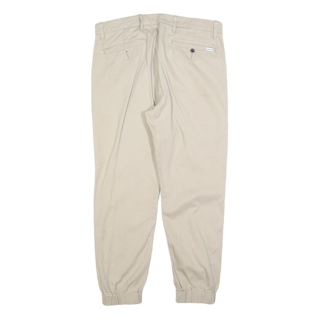 LEVI'S Mens Cotton Blend Beige Slim Tapered Trousers W34 L26 Elasticated Hem